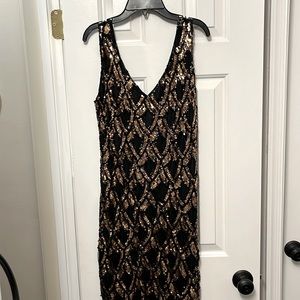 Black and gold sequined midi dress. Fringe hits mid calf